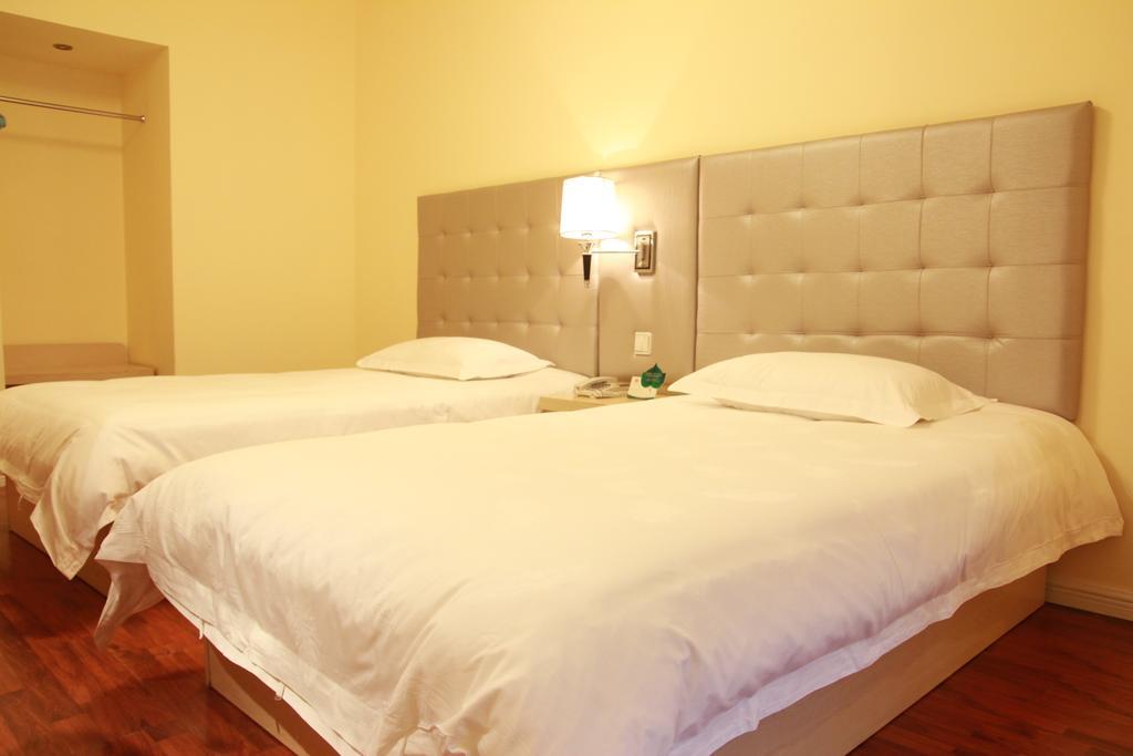 Qingdao Renjia Bussiness Hotel Szoba fotó